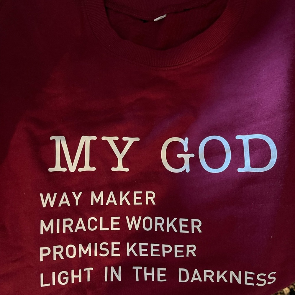 This crewneck sweatshirt is maroon not red. It fits small and was never worn.